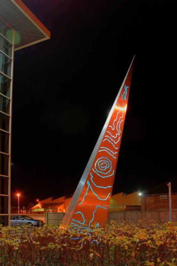 Strata This steel sculpture was recently erected outside the Redcar and Cleveland borough council offices in Rectory Lane. On this face the lights depict the contours of the local landscape which looks very much like Roseberry Topping. If it is Roseberry then only half of it is in Redcar &amp; Cleveland, the other half being in North Yorkshire. The lights change colours from blue through green, red, orange and yellow. On the other face is a similar design but of the artist's finger print. The sculpture was created by Callum Sinclair of Glasgow., close to the Aldi on Hillview Road, Guisborough